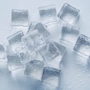 Cold. Frozen ice cubes on the table